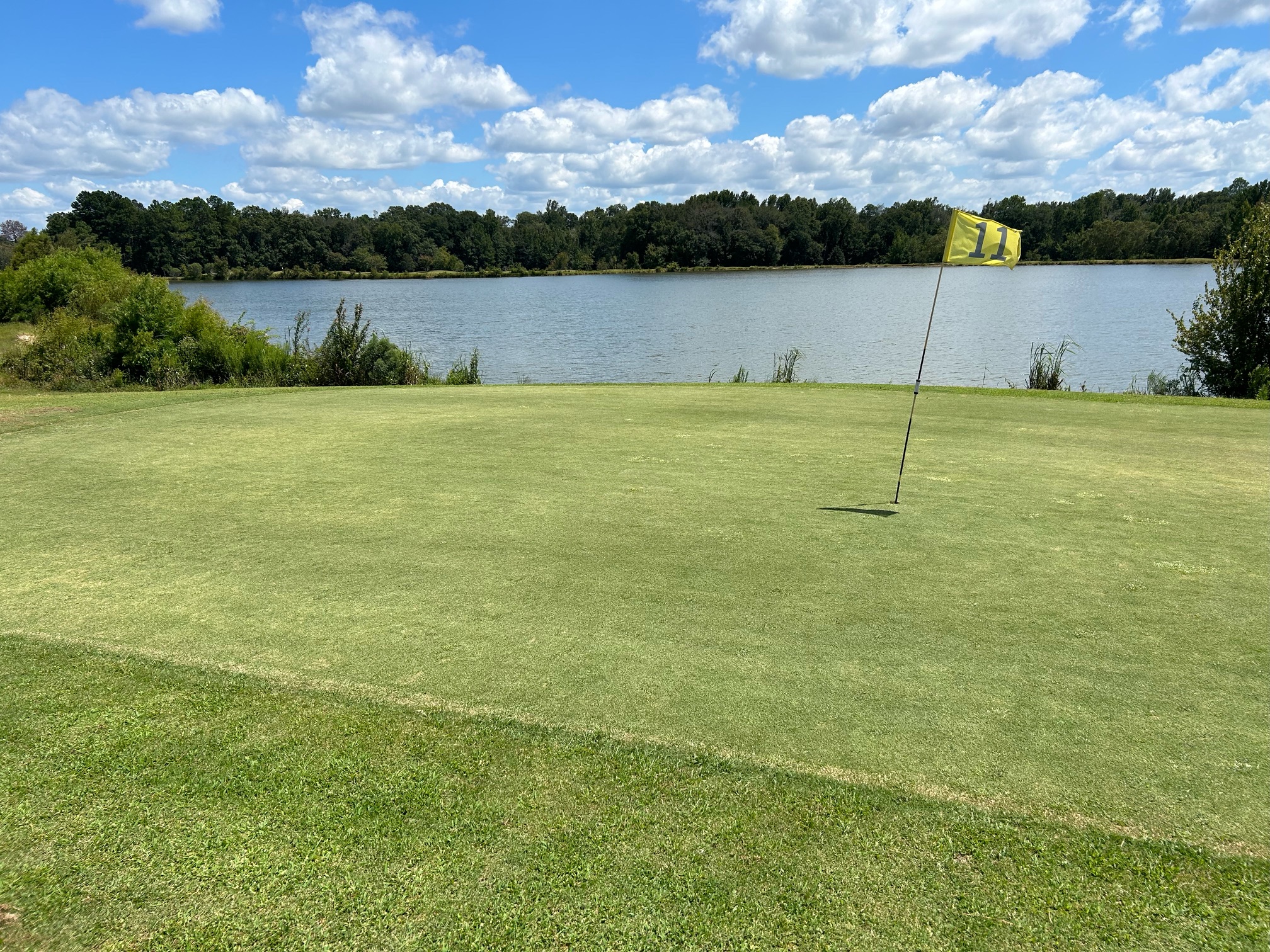Flag overlooking lake on golf course